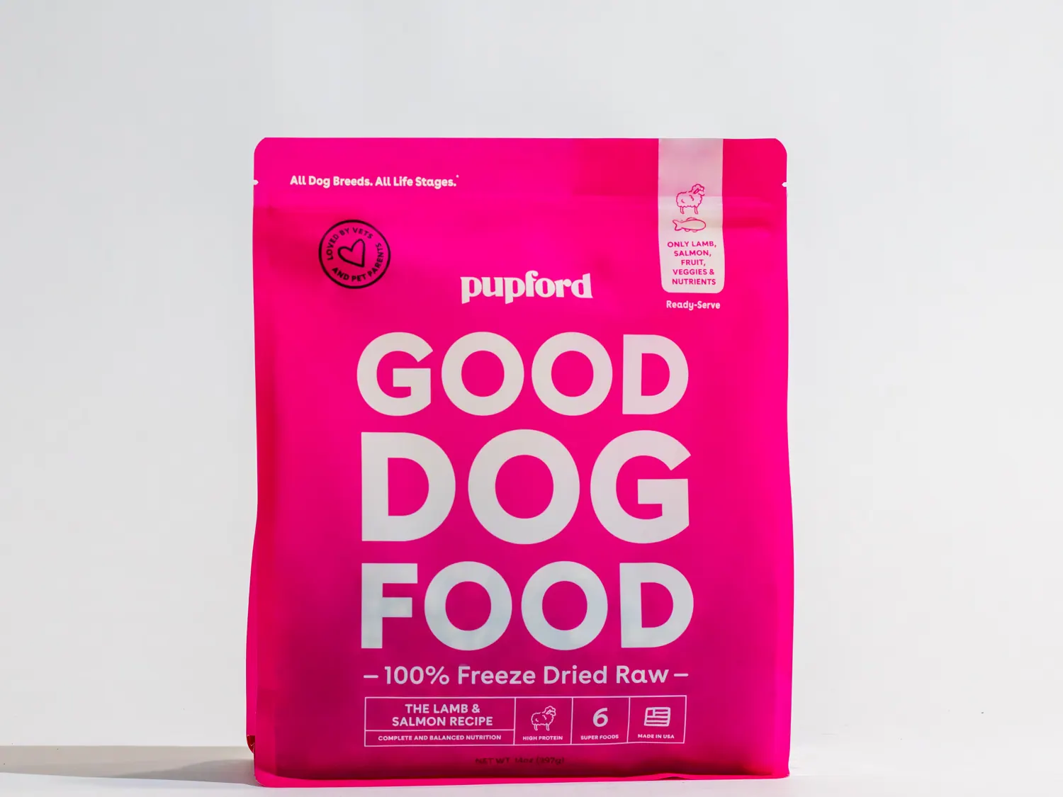 Pink Good Dog Food salmon recipe bag on a light background